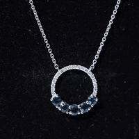 Elegant London Blue Topaz and diamond pendant from Rosec Jewels, showcasing a sparkling eternity necklace design.