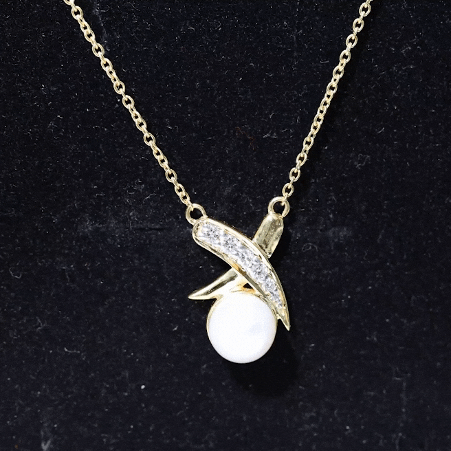 Elegant freshwater pearl and diamond XO pendant necklace by Rosec Jewels featuring a delicate design and sparkling accents.