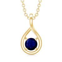 Genuine round-cut blue sapphire teardrop pendant from Rosec Jewels featuring a sparkling blue sapphire gemstone and silver setting.