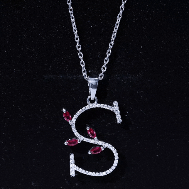 Lab grown ruby and diamond pendant necklace with letter S from Rosec Jewels, featuring a sparkling pendant on a delicate chain.