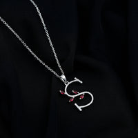 Lab grown ruby and diamond pendant necklace with letter S by Rosec Jewels, featuring sparkling gemstones and elegant design.