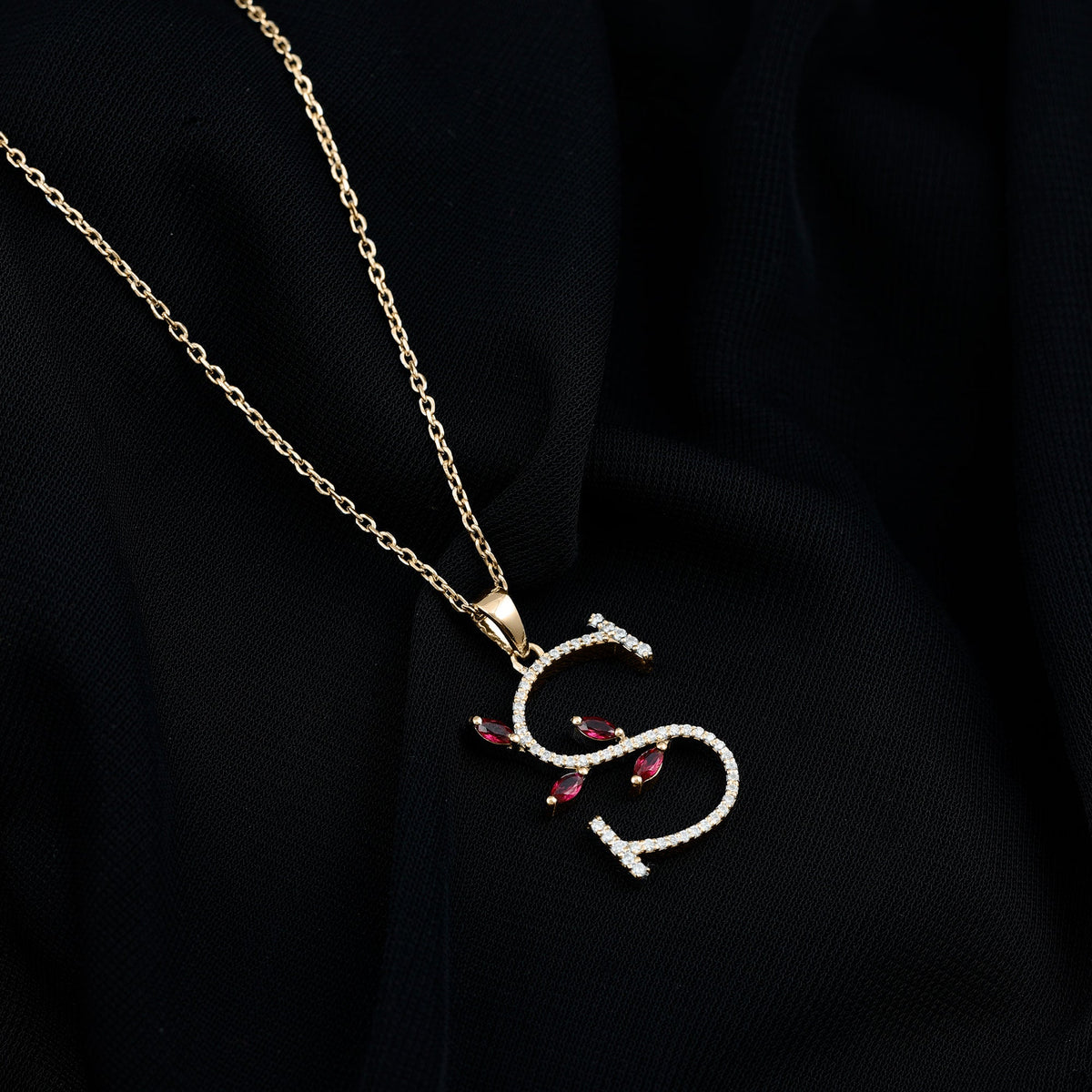 Lab grown ruby and diamond pendant necklace with letter S from Rosec Jewels, featuring a sparkling gemstone design.