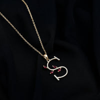 Lab grown ruby and diamond pendant necklace with letter S from Rosec Jewels, featuring a sparkling gemstone design.