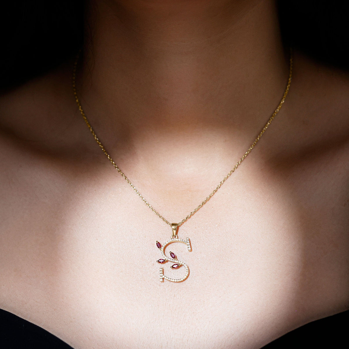 Lab grown ruby and diamond letter S pendant necklace by Rosec Jewels with sparkling gemstones and delicate chain.