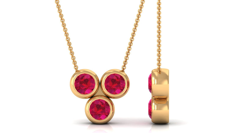 Bezel set ruby three-stone promise pendant necklace for women by Rosec Jewels, featuring sparkling red rubies and elegant design.