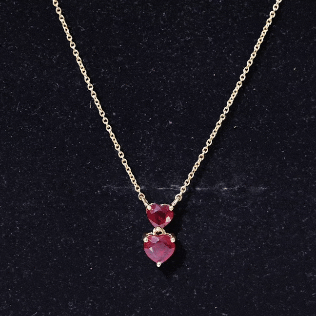 Lab-created 5.5 carat ruby heart pendant on silver chain by Rosec Jewels, showcasing a sparkling ruby heart necklace.
