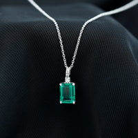 1.6 Carat Emerald Cut Lab Created Emerald Solitaire Necklace with Diamond