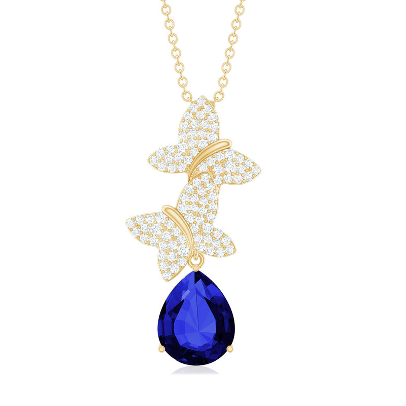 Lab grown blue sapphire butterfly pendant necklace with diamond accents, featuring a delicate butterfly design and sterling silver chain.