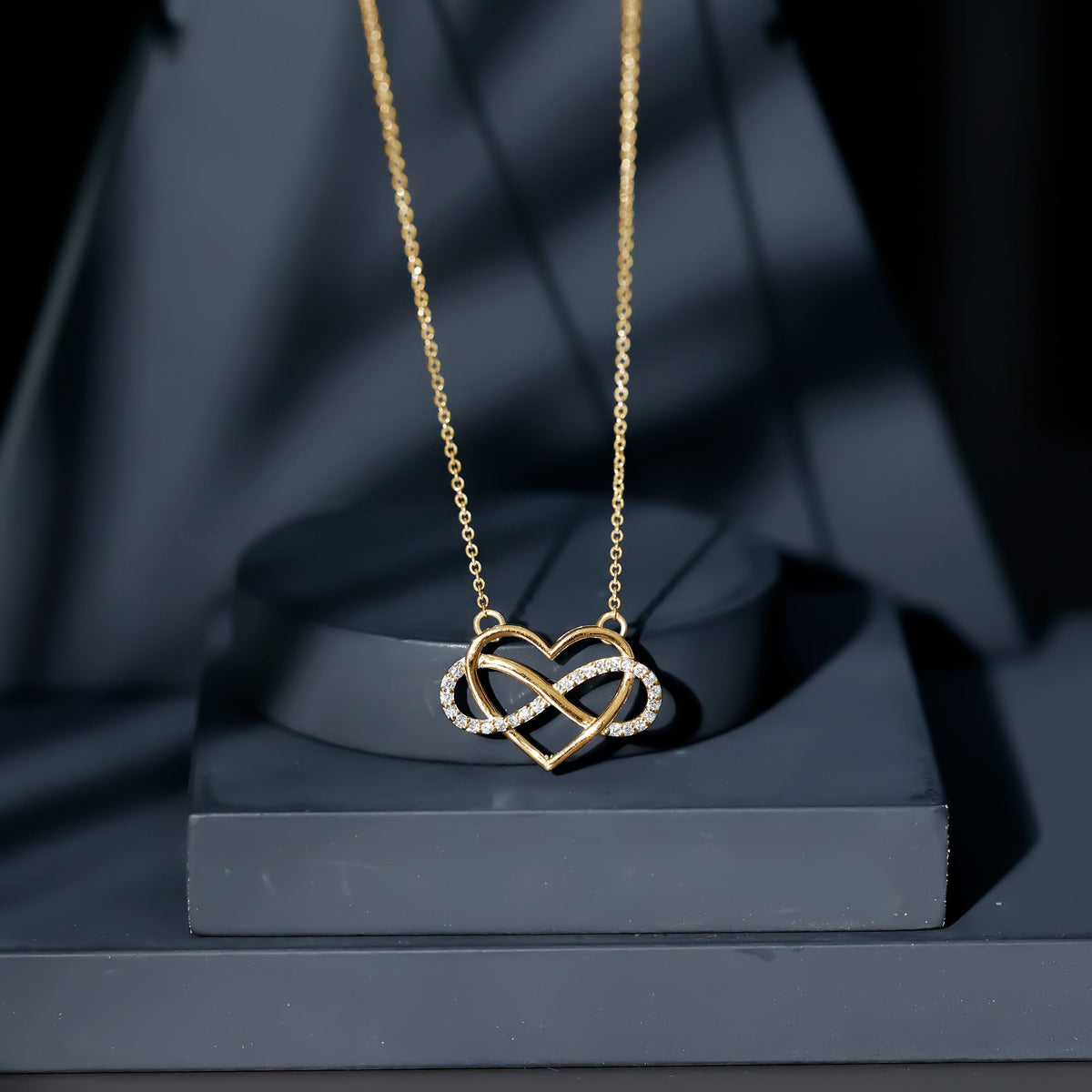 Rosec Jewels certified diamond infinity heart necklace featuring a sparkling diamond pendant on a delicate chain.