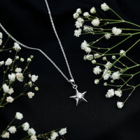 Certified diamond star pendant necklace by Rosec Jewels with a shining star-shaped pendant on a delicate chain.