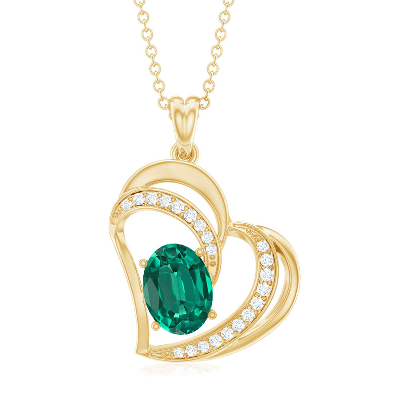 Lab grown emerald heart pendant necklace with diamond accents, featuring a Rosec Jewels pendant on a delicate chain.