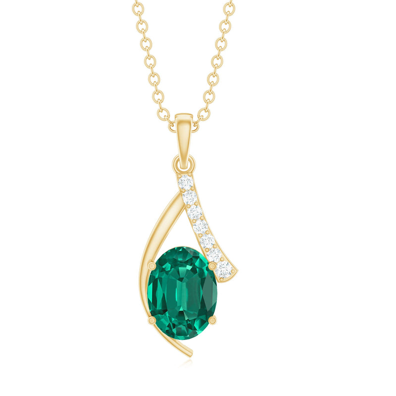 Lab-grown emerald pendant necklace with diamond accent from Rosec Jewels, featuring a vibrant green gemstone and elegant design.