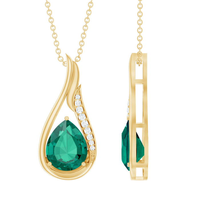 Lab grown emerald teardrop pendant necklace with silver chain from Rosec Jewels, showcasing a vibrant green gemstone.