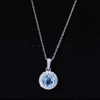 Round cut 2 carat sky blue topaz pendant necklace with silver chain from Rosec Jewels, showcasing the elegant gemstone and chain design.