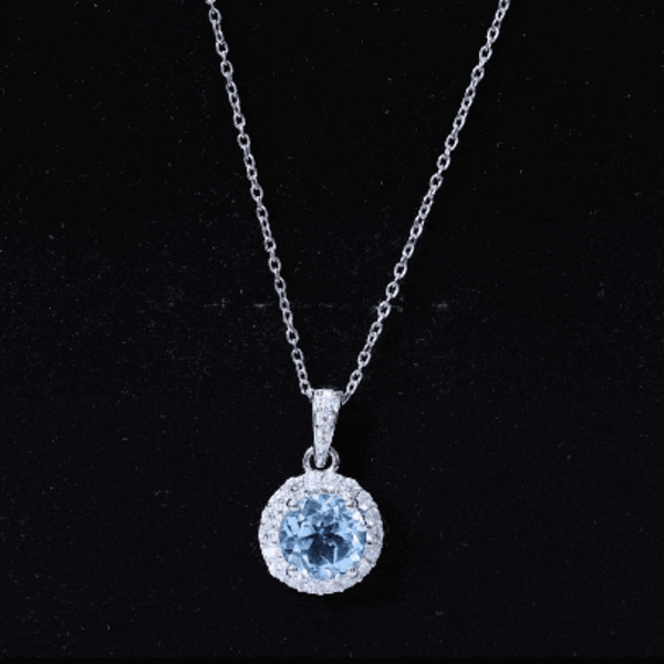 Round cut 2 carat sky blue topaz pendant necklace with silver chain from Rosec Jewels, showcasing the elegant gemstone and chain design.