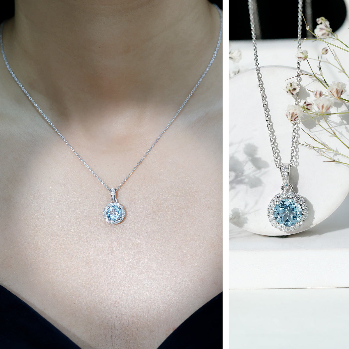 Round cut 2 carat sky blue topaz pendant necklace with silver chain from Rosec Jewels, showcasing the sparkling gemstone and elegant design.