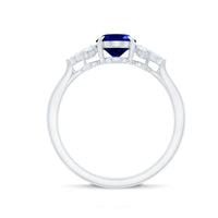 Oval blue sapphire engagement ring with diamond trio, certified 1.5 carats, by Rosec Jewels, showcasing the elegant ring setting.