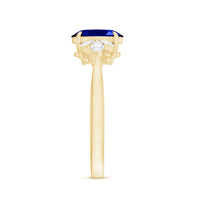 Certified 1.5 carat oval blue sapphire engagement ring with diamond trio by Rosec Jewels, showcasing the elegant ring design.