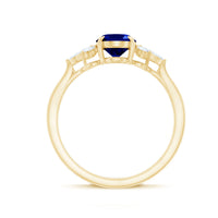 Certified 1.5 Carat oval lab-grown blue sapphire engagement ring with diamond trio, showcasing a elegant jewelry design from Rosec Jewels.