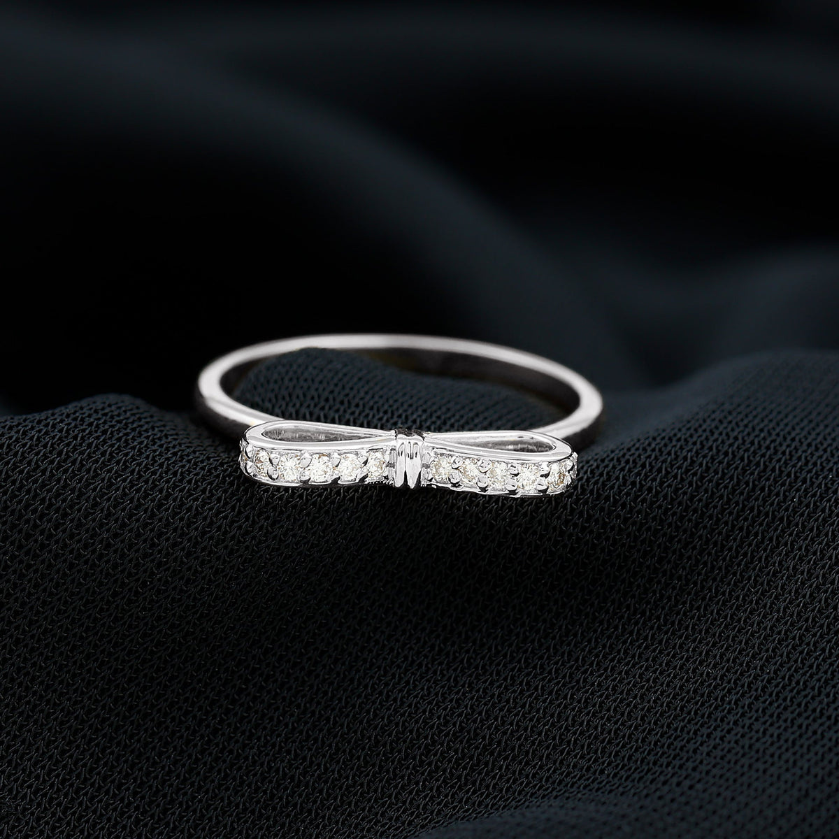 Natural diamond bow promise ring for women by Rosec Jewels, featuring a delicate design with sparkling diamonds on a silver band.