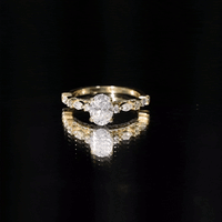 Yellow oval moissanite solitaire engagement ring in claw setting by Rosec Jewels, showcasing the elegant ring design and sparkling stone.