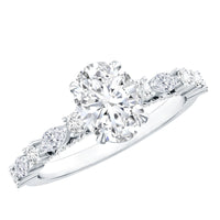 Oval moissanite solitaire engagement ring in claw setting by Rosec Jewels, featuring a sparkling center stone and elegant band.