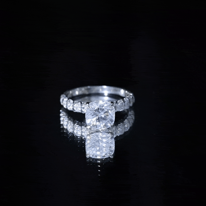Yellow cushion cut moissanite solitaire engagement ring for women, featuring a sparkling center stone on a sleek band.