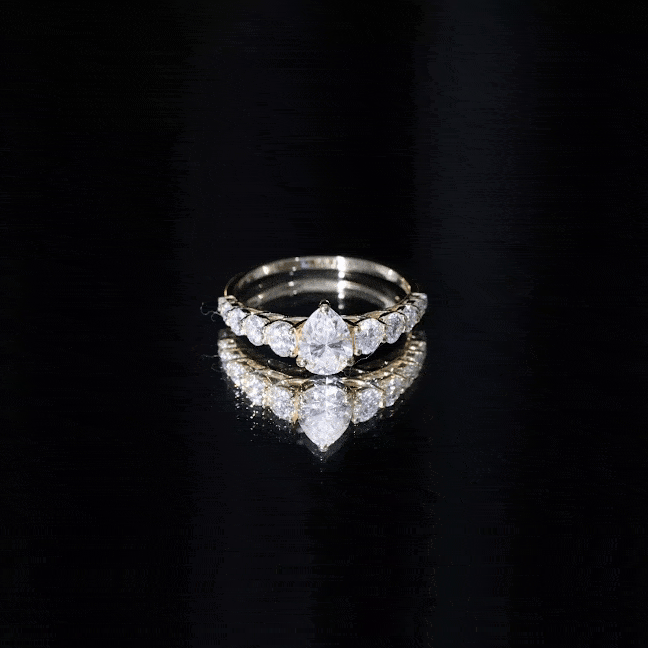Elegant engagement ring from Rosec Jewels featuring a sparkling moissanite center stone and a sleek band design.