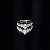 Yellow gold engagement ring with a sparkling moissanite center stone from Rosec Jewels Perfect Pear collection.