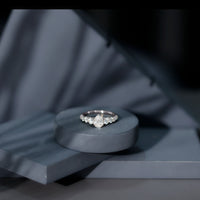 Rosec Jewels Perfect Pear Moissanite Engagement Ring showcasing a pear-shaped center stone and elegant band.