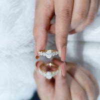 Oval cut 1.2 carat moissanite side stone engagement ring by Rosec Jewels, featuring a sparkling central stone and intricate band design.