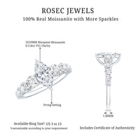 Marquise moissanite engagement ring with side stones from Rosec Jewels, featuring a central moissanite and accent stones on the band.