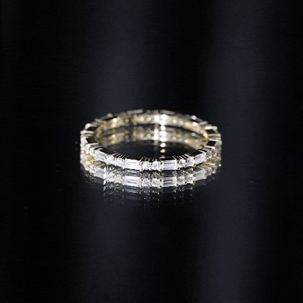 Yellow moissanite stackable enhancer ring by Rosec Jewels featuring sparkling gemstones and a polished gold band.
