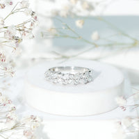 Rosec Jewels certified moissanite cluster eternity ring with sparkling gemstone cluster and sleek band design.