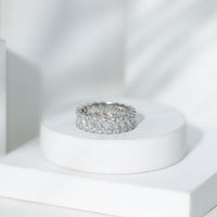Rosec Jewels moissanite braided wedding band featuring a baguette and round cut stones, crafted in elegant ring design.