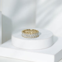 Rosec Jewels moissanite braided wedding band featuring baguette and round stones, crafted in elegant ring design.