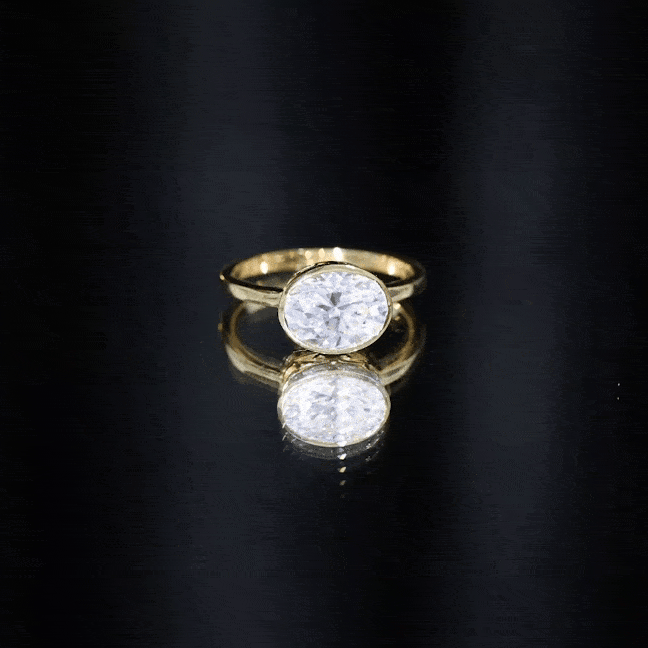 Yellow gold certified 2 carat oval moissanite east-west engagement ring with side stones, from Rosec Jewels.