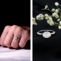 Moissanite east-west bezel engagement ring in rose gold with a central gemstone and elegant band design.