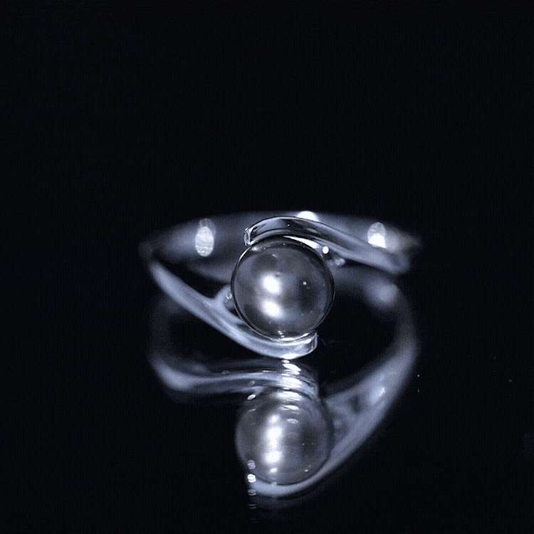 Tahitian black pearl solitaire bypass engagement ring by Rosec Jewels featuring a single black pearl and elegant bypass design.