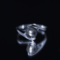 Tahitian black pearl solitaire bypass engagement ring by Rosec Jewels featuring a single black pearl and elegant bypass design.