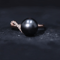 8-carat Tahitian pearl solitaire engagement ring with diamond accent, featuring a Rosec Jewels ring design and white band.