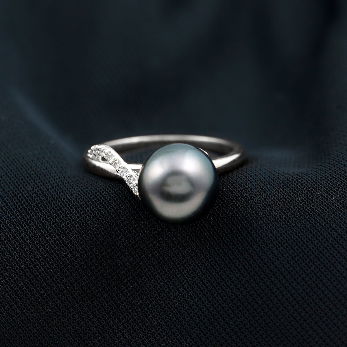 8 carat Tahitian pearl solitaire engagement ring with diamond accents, featuring a sleek band and elegant design.