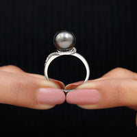 8-carat Tahitian pearl solitaire engagement ring with diamond from Rosec Jewels, featuring a lustrous black pearl set in a sleek ring band.