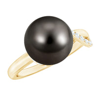 Tahitian pearl solitaire engagement ring with a diamond accent by Rosec Jewels, showcasing a lustrous black pearl and elegant design.