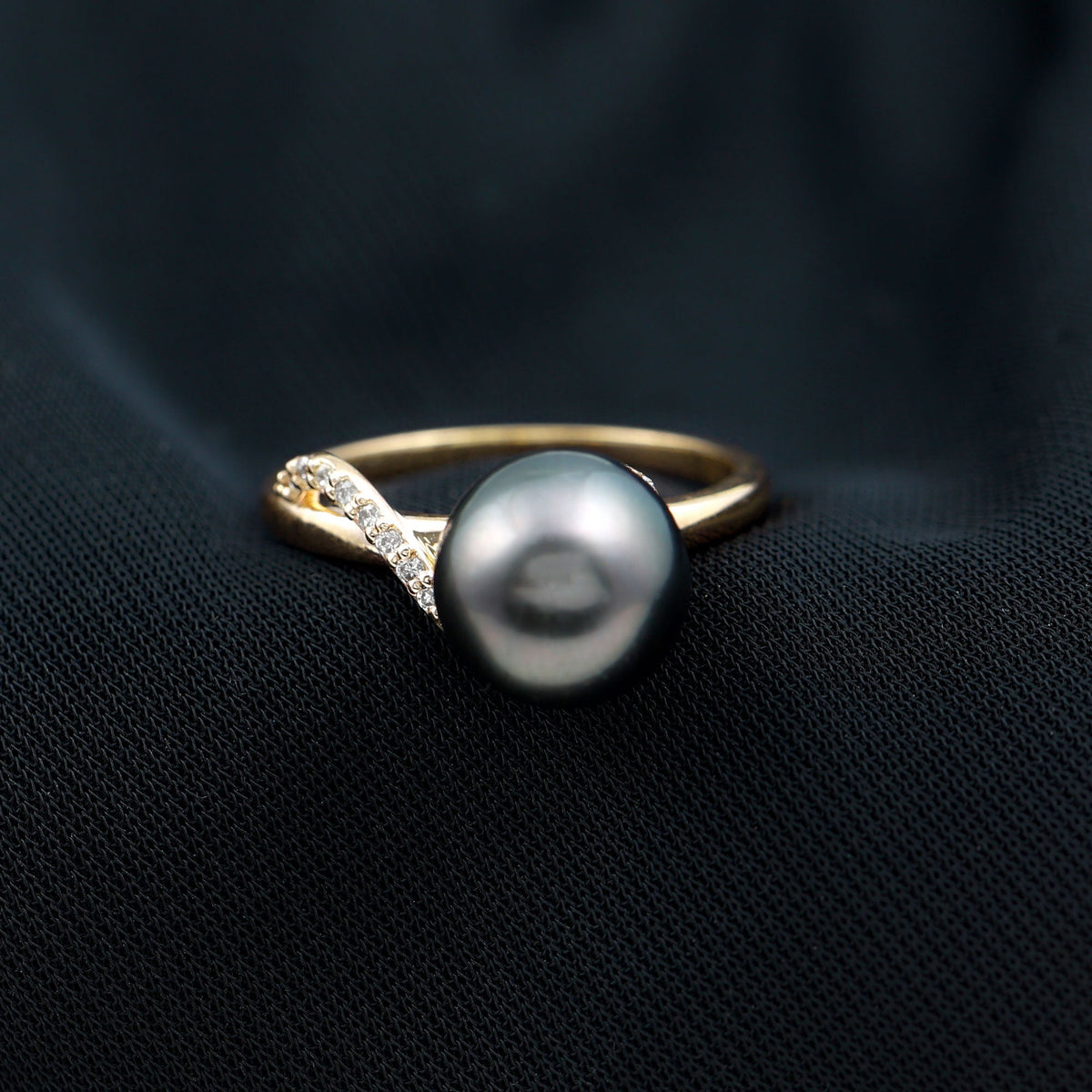 8 carat Tahitian pearl solitaire engagement ring with diamond accent by Rosec Jewels, featuring a prominent dark, lustrous pearl and elegant band.