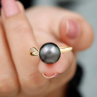 Elegant 8 carat Tahitian pearl solitaire engagement ring with a diamond, featuring a sleek gold band by Rosec Jewels.