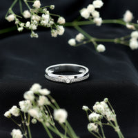 Bezel set diamond unisex wedding band from Rosec Jewels featuring a sleek silver ring with a prominent diamond setting.