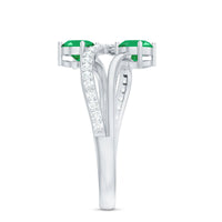 Natural certified emerald two-stone engagement ring with diamonds, featuring a rose gold band and intricate detailing.