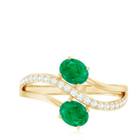 Natural certified emerald two-stone engagement ring with diamonds from Rosec Jewels, showcasing the elegant green emeralds and sparkling accents.