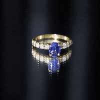 Oval lab-grown blue sapphire engagement ring with diamonds, featuring a 1.5-carat center stone, from Rosec Jewels.